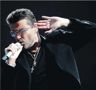  ?? EVERT ELZINGA / AFP / GETTY IMAGES FILES ?? British singer George Michael performs during a concert in Amsterdam.