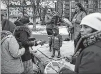  ?? CP PHOTO ?? Mi’kmaq activists stand on the pedestal where the statue of Edward Cornwallis once stood during a rally celebratin­g the statue’s removal in Halifax on Sunday. Cornwallis, the military officer who founded Halifax in 1749, offered a cash bounty to anyone...