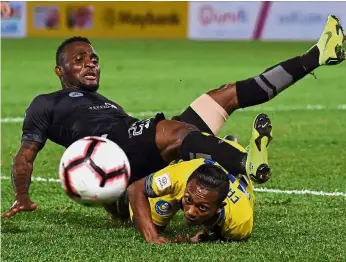 ??  ?? Step it up: Terengganu skipper Kipre Tchetche (left) has to rediscover his scoring form in the Super League match against Kuala Lumpur today. — Bernama