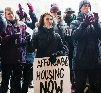  ?? ERROL McGIHON ?? Tammy Corner takes part in a rally for affordable housing outside city hall before council discussed its 2019 budget on Wednesday. Many were pleased with measures in the draft budget.