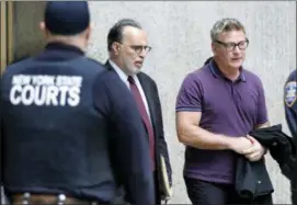  ?? RICHARD DREW — THE ASSOCIATED PRESS ?? Actor Alec Baldwin, right, and his attorney Alan Abramson, leave New York Supreme Court, in New York, Monday.