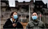  ??  ?? Safety first: Tourists wear masks on a visit to Edinburgh Castle yesterday