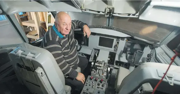  ?? JASON PAYNE ?? Former pilot Walt Lazaruk mans the cockpit of a Boeing 737-200 that he converted to a flight simulator, in Richmond on Thursday. Lazaruk bought the cockpit from a California aircraft boneyard in 2004 and rebuilt it as a flight simulator. He’d now like...