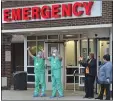  ??  ?? Delaware County Memorial Hospital Emergency Department staff wave to first responders during a salute to their efforts last week.