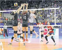  ?? FIVB ?? South Korea’s Kim Yeon-Koung, white shirt No.10, hits a shot against Thailand.