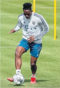  ?? DEFODI IMAGES GETTY IMAGES FILE PHOTO ?? Alphonso Davies of Bayern Muenchen controls the ball during a training session. The Bundesliga is set to resume play May 15.