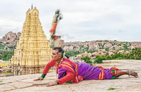  ??  ?? APART from singing and acting, Manjamma’s expertise lies in dancing by balancing a pot on her head. The pot dance with Yellamma idol is an intrinsic part of the Jagathi nritya repertoire. Manjamma performing at Hampi.