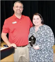  ??  ?? Chamber president Dale Reed poses with past president Taryn Golden. Golden received a service award for her years as chamber president.