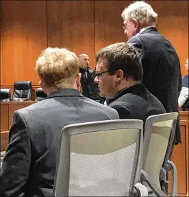  ?? LAWRENCE BUDD / STAFF ?? John Austin Hopkins (center) awaits the verdict Friday in Warren County Common Pleas Court. He was convicted on 34 counts of gross sexual imposition.