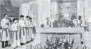  ??  ?? Fr Joseph Chai (second right), assisted by Rector Fr Paul Herry (third right) and Fr Arockya Raj (right) celebratin­g the Chinese New Year Mass.