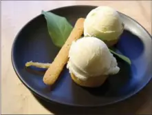  ??  ?? Meyer lemon ice cream and sorbet, a dessert from chef Alice Waters’ Chez Panisse.