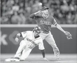  ?? Stephen Brashear Getty Images ?? AFTER GETTING the force on Seattle’s Ben Gamel at second base, Angels shortstop Andrelton Simmons bobbles the ball in the first inning.