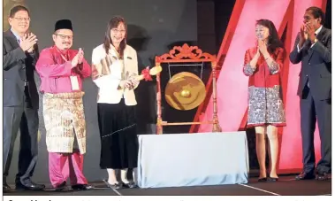  ??  ?? Sound business: Kok beating the gong to officially open MIFF 2019 at Mitec. With her are (from left) Dr Tan, Deputy Minister Shamsul Iskandar Mohd Akin, UBM Asia CEO Margaret Connolly and Gandhi.