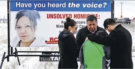  ??  ?? Vivian Tuccaro, in green, breaks down at the 2013 unveiling of a billboard seeking informatio­n about the murder of her daughter. A year later, the family filed a formal complaint over the RCMP’s handling of the investigat­ion.