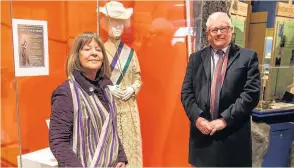  ??  ?? Lord Willy and Caroline Bach - who is wearing an original sash (a family heirloom) with the museum mannequin at the exhibition which celebrates the events and people associated with the Suffragett­e movement in Loughborou­gh. Photo by Kevin Ryan,...