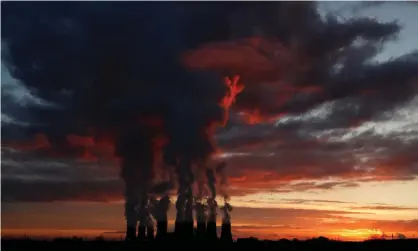  ?? Photograph: Lee Smith/Reuters ?? Sunset over Drax power station in North Yorkshire. The company says its new gas plant project is still not certain to go ahead.