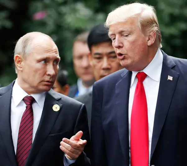  ?? Photo: Jorge Silva/AP ?? CRISIS LOOMS: US president Donald Trump and Russia’s president Vladimir Putin talk during the APEC Summit in Danang, Vietnam, yesterday.