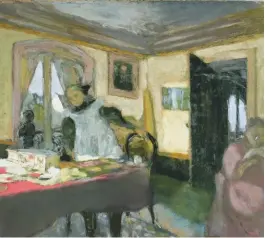  ??  ?? The Laden Table (La Table encombrée) shows Mme Vuillard reading a book (right) and her grandchild­ren Annette and Jacques