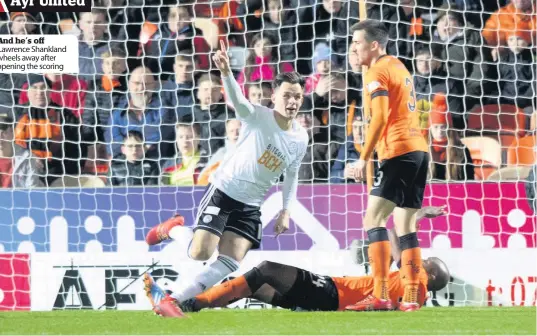  ??  ?? And he’s off Lawrence Shankland wheels away after opening the scoring