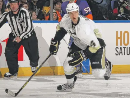  ?? BRUCE BENNETT/GETTY IMAGES (ABOVE), JONATHAN DANIEL/GETTY IMAGES ?? Mark Eaton (above, in 2013) is now the Hawks’ assistant general manager for player developmen­t after his work with Nicolas Beaudin (below, left), Adam Boqvist and other young prospects.