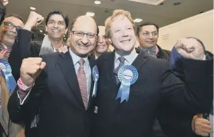  ??  ?? Paul Bristow c elebrating victory on election night with re-elected NW Cambs MP Shailesh Vara