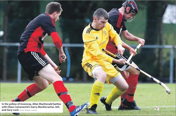  ?? Photo: Stephen Lawson. ?? In the yellow of Inveraray, Allan MacDonald battles with Oban Camanachd’s Garry MacKerrach­er, left, and Gary Lord.