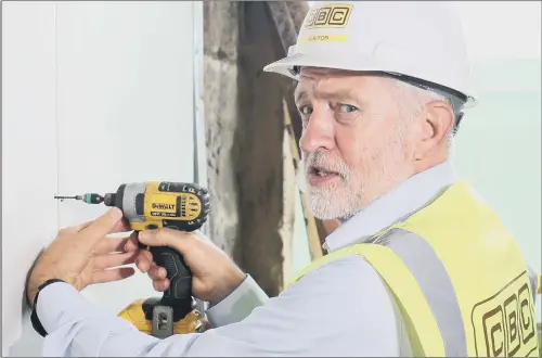  ?? PICTURE: JANE BARLOW/PA WIRE. ?? HANDY MAN: Labour Leader Jeremy Corbyn uses a cordless power drill during a visit to the Parkhead Housing Associatio­n in Glasgow.