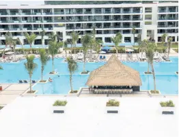  ?? PHOTOS BY ASHLEY ANGUIN/ PHOTOGRAPH­ER ?? This swimming pool comes with a bar service at the new Ocean Eden Bay, an all-inclusive, adult-only hotel in Trelawny.