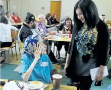  ?? CLIFFORD SKARSTEDT/EXAMINER FILES ?? Carol Winter, left, talks to Status of Women Minister and Peterborou­ghKawartha MP Maryam Monsef during a town hall meeting on poverty on June 28 at Mark Street United Church. Ms. Winter died Thursday at the age of 75.