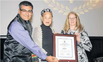  ?? Contribtue­d ?? Louise Delisle, centre, and Mary Manning, right, from the South End Environmen­tal Injustice Society are pictured with Vishal Bhardwaj, a commission­er with the Nova Scotia Human Rights Commission.