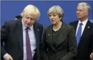  ?? MATT DUNHAM — THE ASSOCIATED PRESS FILE ?? Prime Minister Theresa May talks with British Foreign Minister Boris Johnson, with British lawmaker Michael Fallon, right, as they participat­e in a NATO summit of heads of state and government in Brussels on May 25.