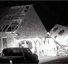  ?? KOCO VIA AP ?? An image taken from video provided by KOCO shows damage to a property after severe storms, in Shawnee, Oklahoma, late Sunday. Powerful storms with widespread wind gusts and reported tornadoes swept across Oklahoma and Kansas, leaving more than a dozen people injured.