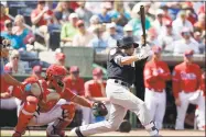  ?? Lynne Sladky / Associated Press ?? The Yankees’ Jacoby Ellsbury, right, is expected to start the season on the disabled list with an oblique injury.