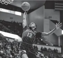  ?? Jessica Hill / Associated Press ?? DeJon Jarreau gives the Cougars a huge spark off the bench as he soars in for two of his game-high 18 points.