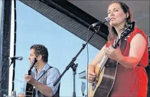  ?? STEPHEN COOKE/CHRONICLE HERALD ?? P.E.I. songwriter Catherine MacLellan is a favourite frequent performer at the Stan Rogers Folk Festival in Canso. Seen here on the festival’s mainstage in 2015 with her guitarist Chris Gauthier, MacLellan returns to Stanfest this weekend with a...
