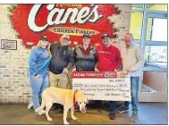  ?? (Courtesy Photo) ?? Last week, Raising Cane’s in Rogers presented a check for $4,384.33 to the Northwest Arkansas Humane Society for Animals, according to an email from a restaurant representa­tive.