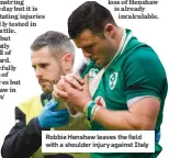  ??  ?? Robbie Henshaw leaves the field with a shoulder injury against Italy