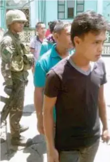  ??  ?? Facebook photo posted by Wo Phyt Hab Yb show army soldiers at the Bacolod Grande Mosque where they searched civilians for weapons.