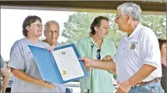  ?? Herald-Leader file photo ?? Oklahoma State Rep. David Hardin (R-District 86), right, presents West Siloam Springs Mayor Elaine Carr, left, with a proclamati­on recognizin­g the city’s 50th anniversar­y during a celebratio­n in July of 2019.