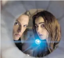 ?? EONE FILMS ?? Jamie Campbell Bower, left, and Lily Collins co-star in The Mortal Instrument­s: City of Bones. ‘We clicked right away,’ said Collins.