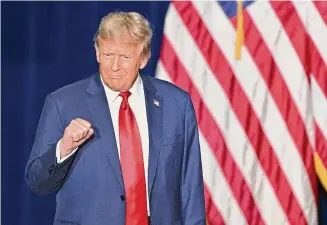  ?? ?? Former president and Republican presidenti­al hopeful Donald Trump arrives at a watch party during the 2024 Iowa Republican presidenti­al caucuses in Des Moines, Iowa, on Monday.