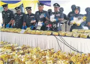  ?? REUTERS ?? Malaysian customs’ officials display 1,187kg of methamphet­amine seized at a press conference in Nilai, Malaysia.