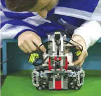  ??  ?? NEW DELHI: A participan­t from Greece gets his robot ready for a game of soccer at the World Robot Olympiad in New Delhi, India. The weekend games brought more than 450 teams of students from 50 countries to the Indian capital. — AP