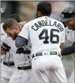  ?? JOSE JUAREZ — THE ASSOCIATED PRESS ?? Detroit Tigers’ Robbie Grossman, left, is congratula­ted by teammates after drawing a walk with the bases loaded, giving Detroit an 8-7 win over the Tampa
Bay Rays in 11 innings on Sunday.