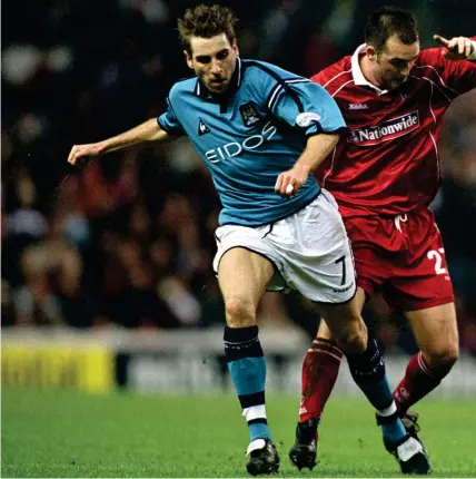  ??  ?? Paul McAreavey in action for Swindon in 2002 before returning to Northern Ireland and subsequent­ly joining Linfield