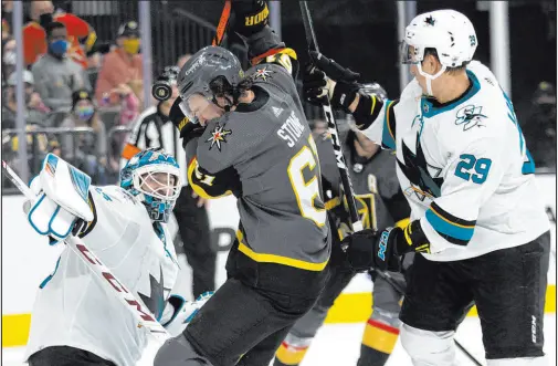  ?? Ellen Schmidt Las Vegas Review-journal @ellenschmi­dttt ?? The puck bounces off Mark Stone’s ear midway through the first period as the Knights’ captain tries to screen Sharks goaltender Adin Hill.