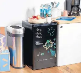  ?? WALMART ?? This retro-style 3.2-cubic-foot dry-erase fridge with neon markers lets you write and erase lists and notes right on the fridge door.