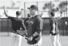  ?? Karen Warren/staff photograph­er ?? Tommy Kawamura, the Astros’ major league game-planning coach, holds a degree in mathematic­s and economics and never played profession­al baseball.