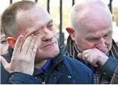  ??  ?? Tears: John Harbinson’s son Aaron, and Joe Convie, whose son Gary was killed