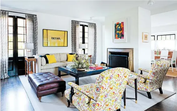  ?? AMY BARTLAM/AMY SKLAR DESIGN ?? Amy Sklar, of Amy Sklar Design, loves bold floral prints that feel modern and classic, such as these chairs — classic shape with a pattern that pops.